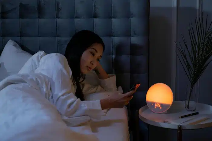 Woman Using her Phone at night