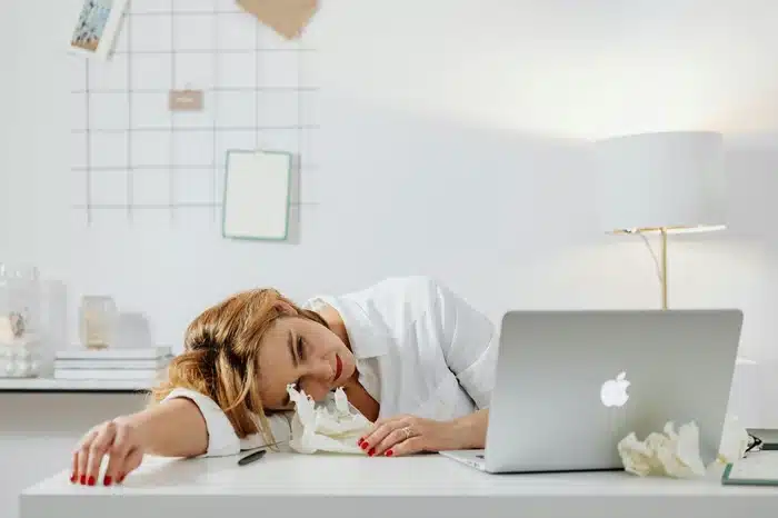 Female worker drowsy at work